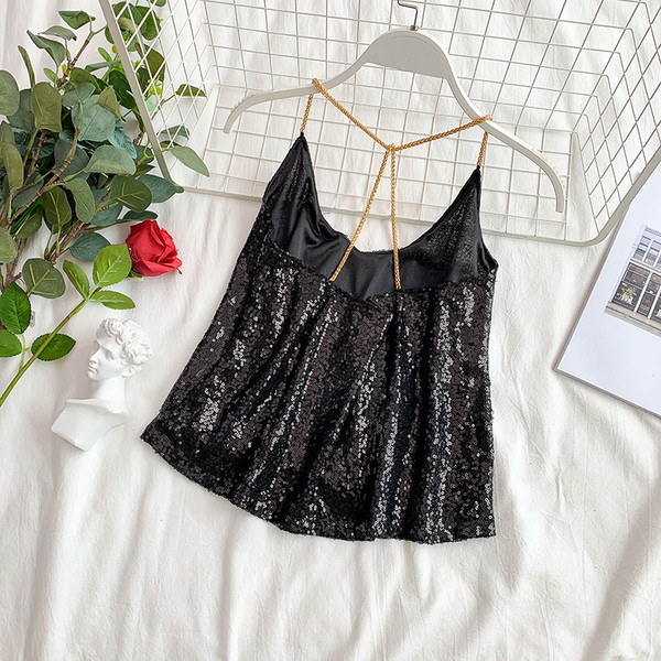 Modern női felső, ezüst és fekete flitterekkel