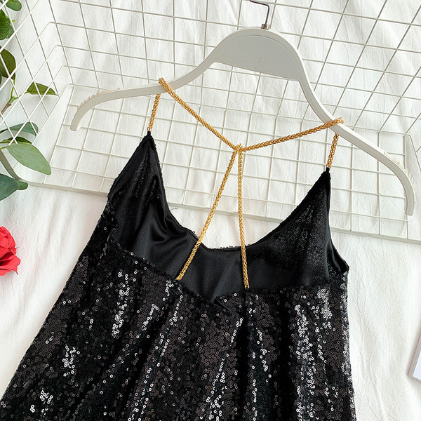 Modern női felső, ezüst és fekete flitterekkel