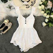 Salopetă de damă modernă cu elemente cu nasturi în alb și negru