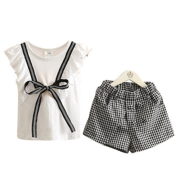 Modern, kétrészes blúzból és nadrágból álló gyerekszett lányoknak