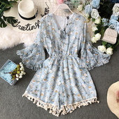 Modern női jumpsuit lótusz ujjal és bojttal