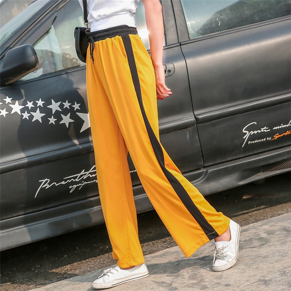 Alkalmi női nadrág zöld és sárga színben