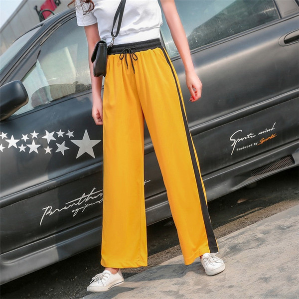 Alkalmi női nadrág zöld és sárga színben