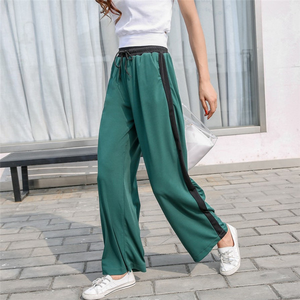 Alkalmi női nadrág zöld és sárga színben