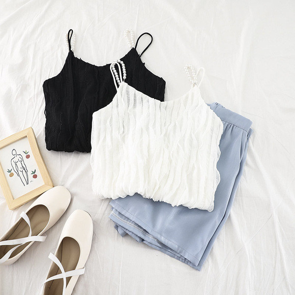 Stílusos női felső gyöngy díszítéssel, fehér és fekete színben