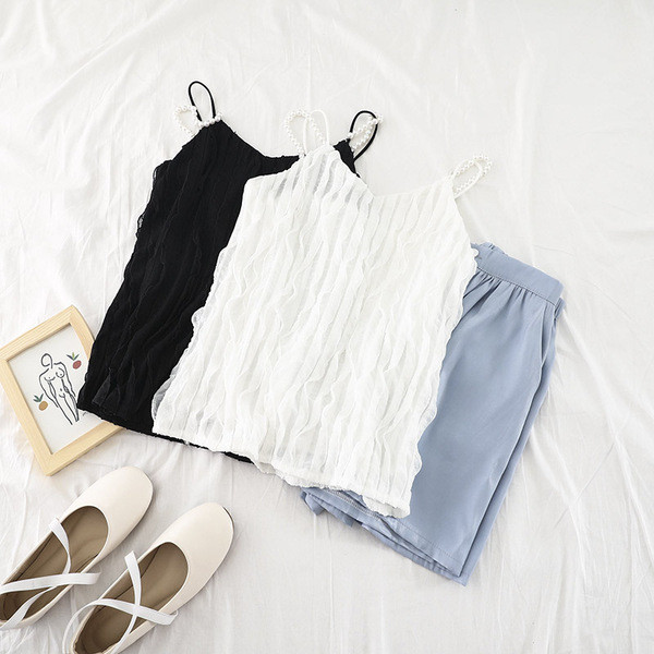 Stílusos női felső gyöngy díszítéssel, fehér és fekete színben