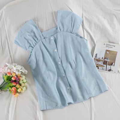 Modern női felső több színben, gombokkal és széles pántokkal