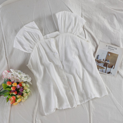 Modern női felső több színben, gombokkal és széles pántokkal