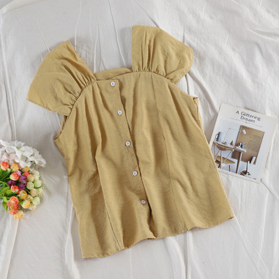 Modern női felső több színben, gombokkal és széles pántokkal