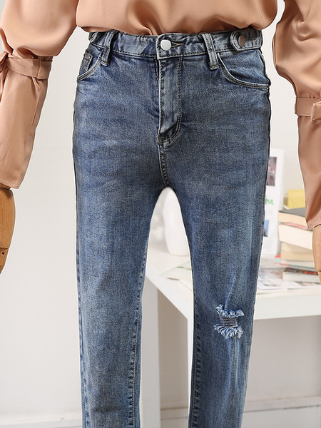 Modern női farmer magas derékkal, szakadt motívumokkal