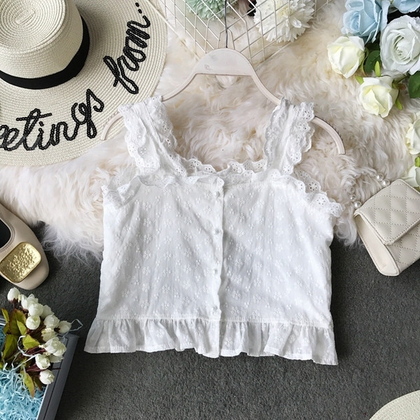 Modern női felső, széles pántokkal és gombokkal