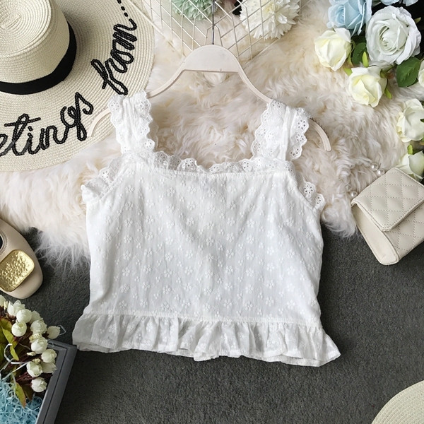 Modern női felső, széles pántokkal és gombokkal