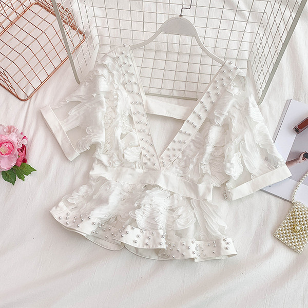 Bluză de damă elegantă cu decolteu în V și decor cu perle