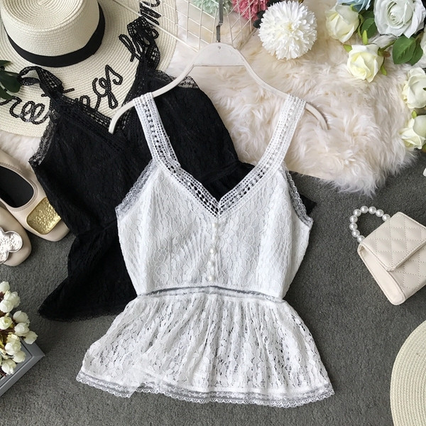 Stílusos női felső, fehér és fekete gombokkal