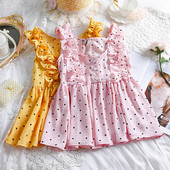 Modern női felső, négy színű pöttyök gombokkal