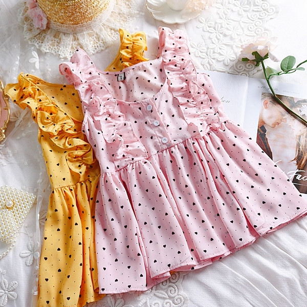 Modern női felső, négy színű pöttyök gombokkal