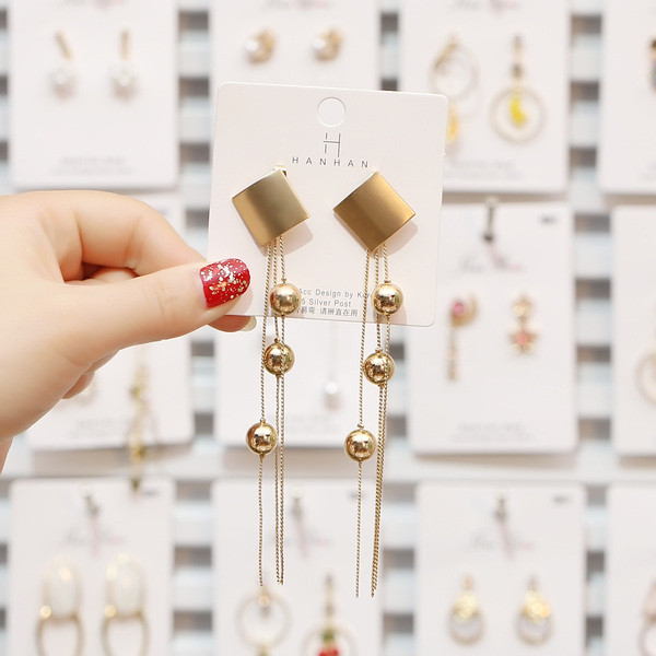 Új, arany színű női fülbevaló modell