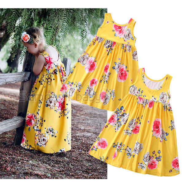 Stílusos hosszú gyerekruha sárga színben virágos motívumokkal