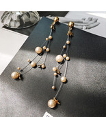 Modern női fülbevaló dekoratív gyöngyökkel - két színben