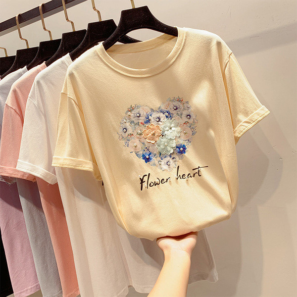 Női póló rövid ujjal, virágos elemekkel