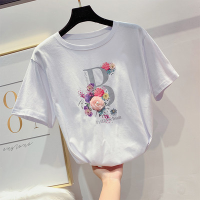 Modern női póló virágdíszítéssel