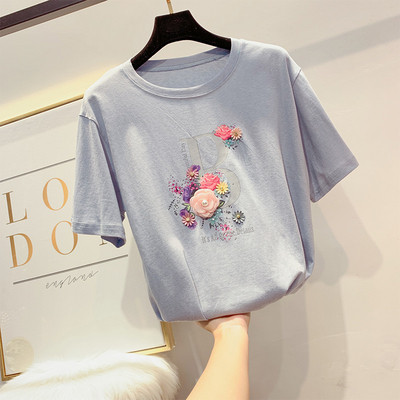 Modern női póló virágdíszítéssel