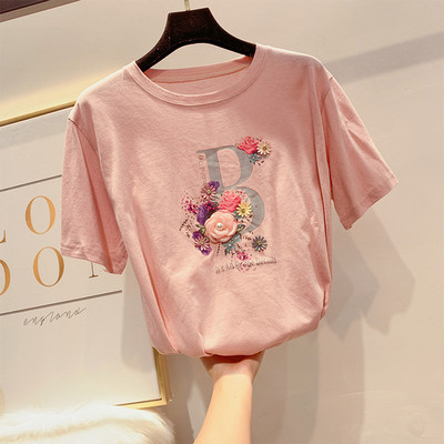 Modern női póló virágdíszítéssel