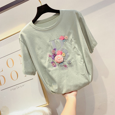 Modern női póló virágdíszítéssel