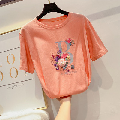 Modern női póló virágdíszítéssel