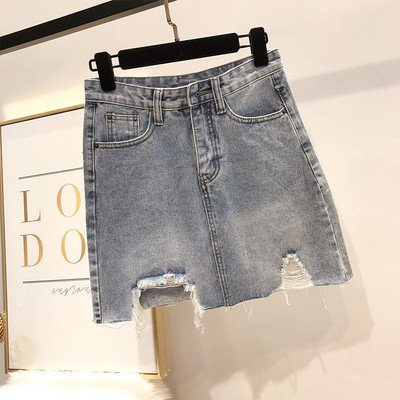 Női farmerszoknya szakadt motívumokkal, magas derékkal