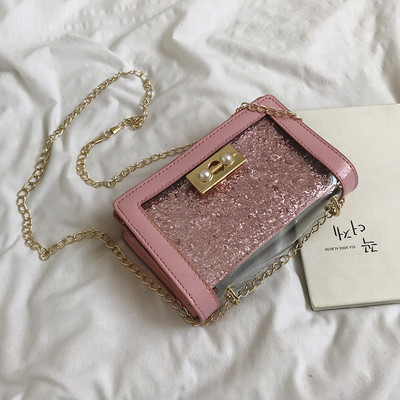 Stílusos női táska fényes hatású fém fogantyúval több színben