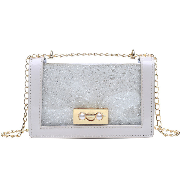 Stílusos női táska fényes hatású fém fogantyúval több színben