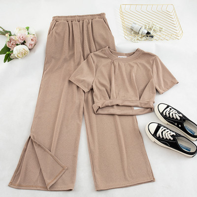 Két darab nadrágból és blúzból álló alkalmi női szett több színben