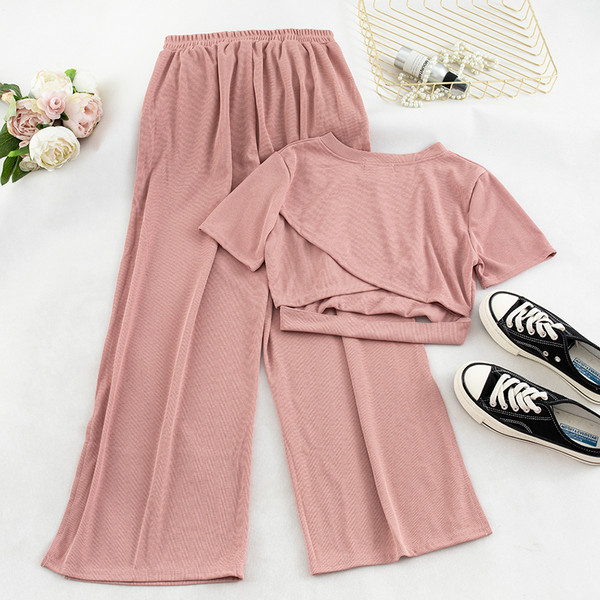 Két darab nadrágból és blúzból álló alkalmi női szett több színben