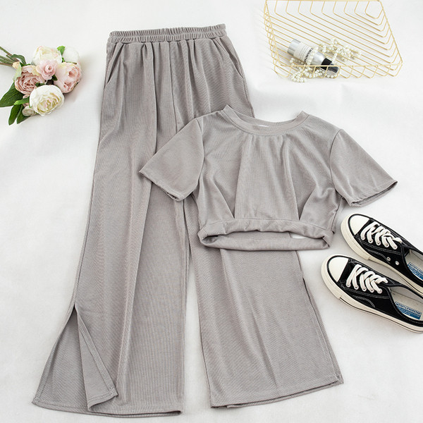 Két darab nadrágból és blúzból álló alkalmi női szett több színben