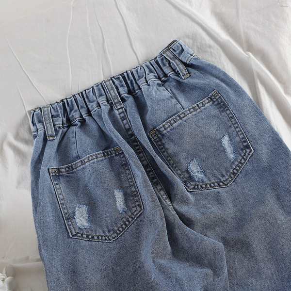 Női hosszú farmer szakadt elemekkel