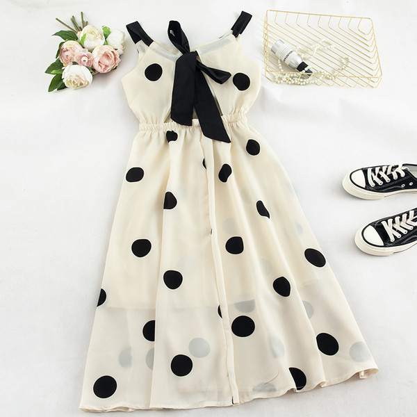 Stílusos női pöttyös ruha fehér és fekete színben