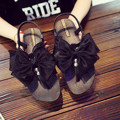 Modern női szandál szalaggal és gyöngyökkel több színben