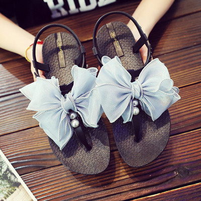 Modern női szandál szalaggal és gyöngyökkel több színben