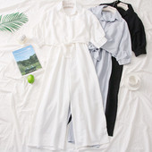 Modern női overall 3/4-es ujjakkal és gombokkal