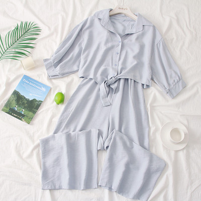 Modern női overall 3/4-es ujjakkal és gombokkal