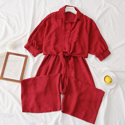 Modern női overall 3/4-es ujjakkal és gombokkal