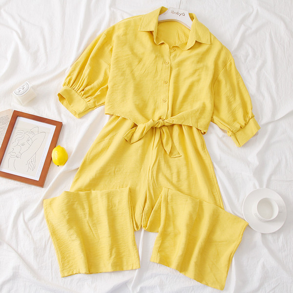 Modern női overall 3/4-es ujjakkal és gombokkal