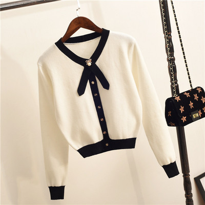 Vestă elegantă de damă cu decolteu în V în alb-negru