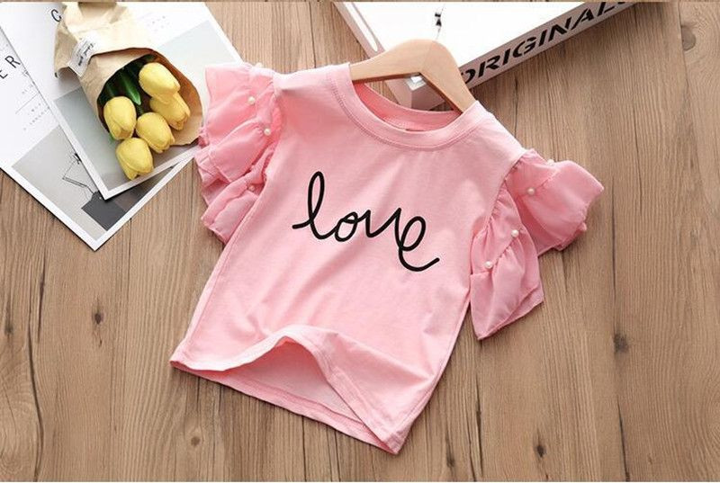 Set modern pentru copii de bluză și pantaloni cu aplicație pentru fete