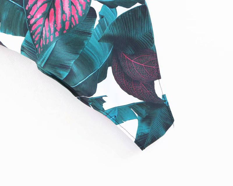 Modern teljes fürdőruha virágmintával és keresztpántokkal