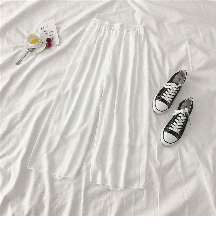 Női széles modellnadrág fehér és fekete színben