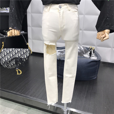 Modern női farmer, szürke és fehér szakadt motívumokkal