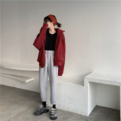 Pantaloni sport de damă, de culoare gri și negru, cu fermoar