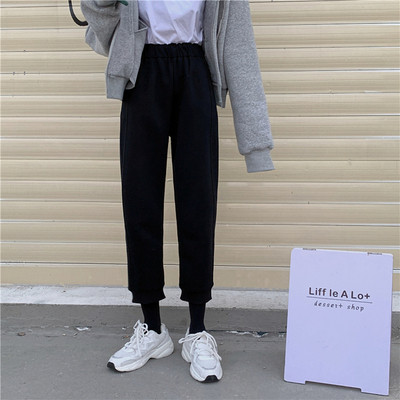 Pantaloni sport de damă, de culoare gri și negru, cu fermoar